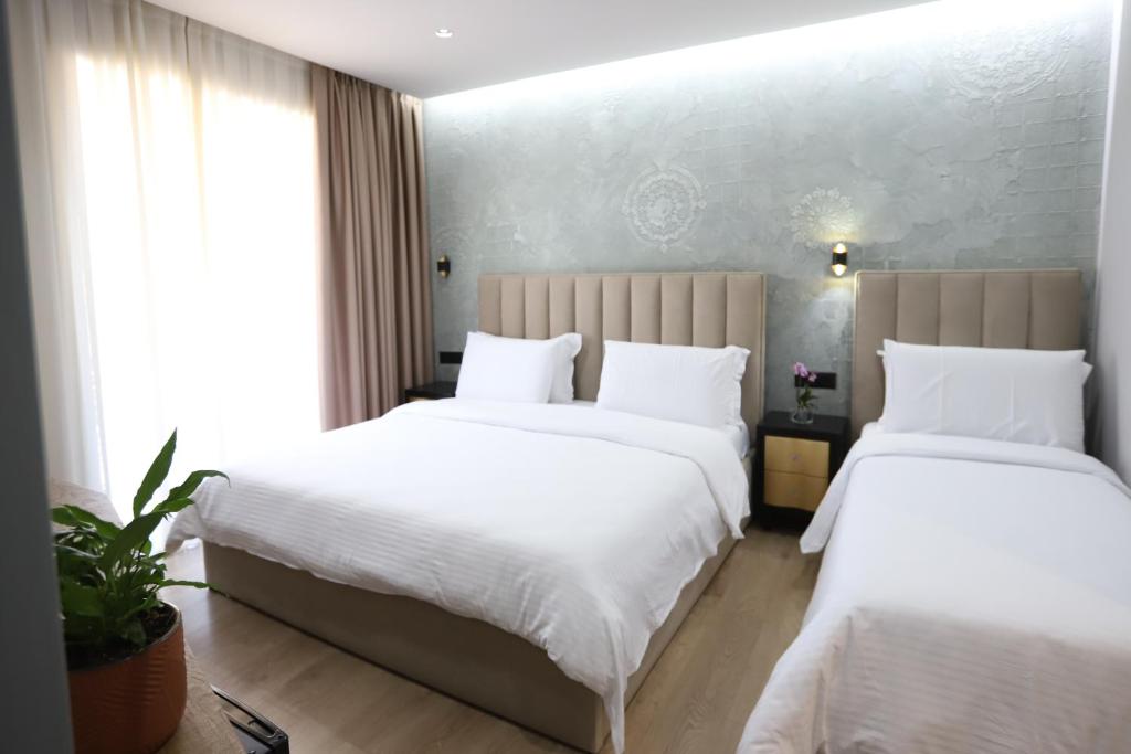 Postel nebo postele na pokoji v ubytování Imperator Hotel