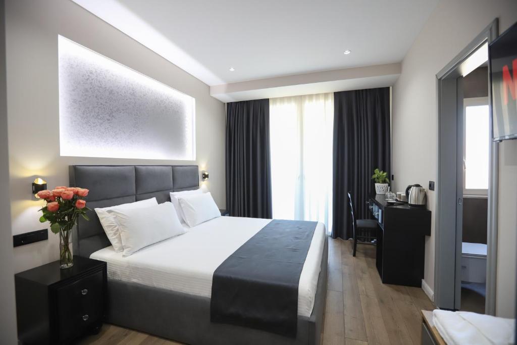 Postel nebo postele na pokoji v ubytování Imperator Hotel