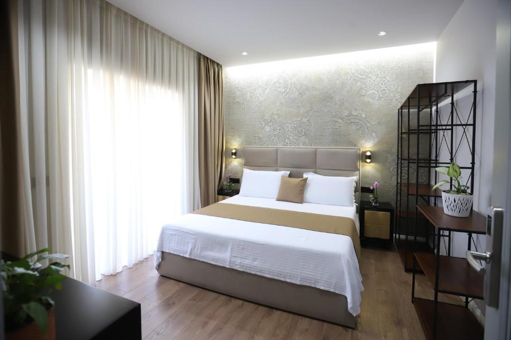 Postel nebo postele na pokoji v ubytování Imperator Hotel