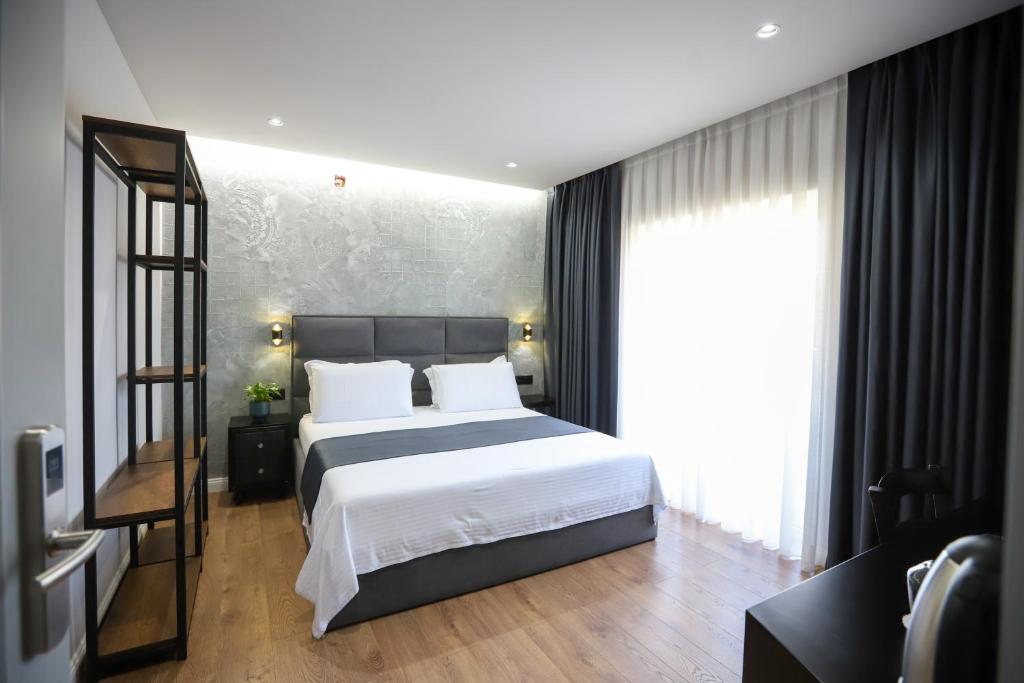 Postel nebo postele na pokoji v ubytování Imperator Hotel