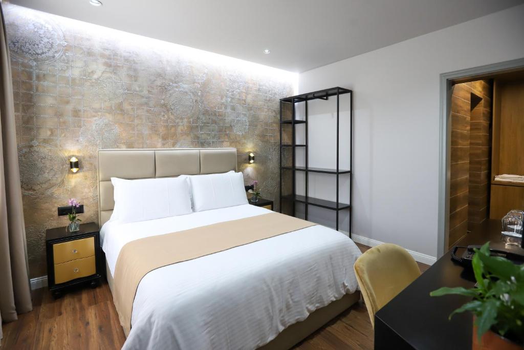 Postel nebo postele na pokoji v ubytování Imperator Hotel