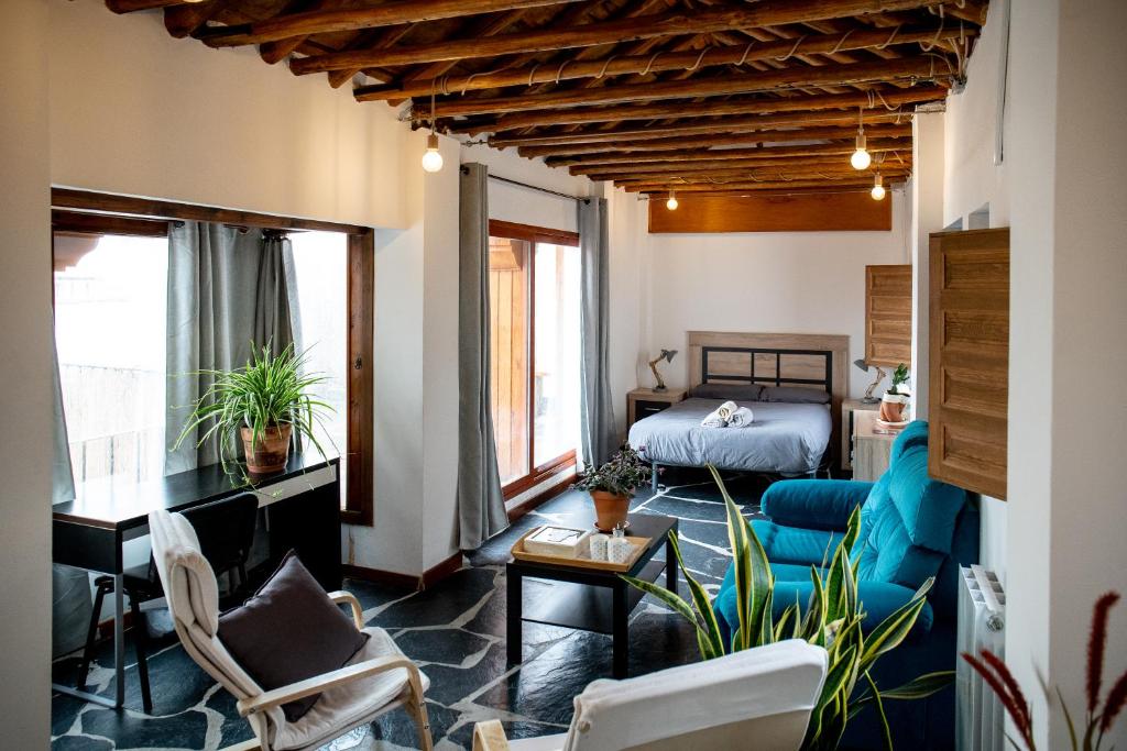 a living room with a bed and a couch at Casa Po in Granada