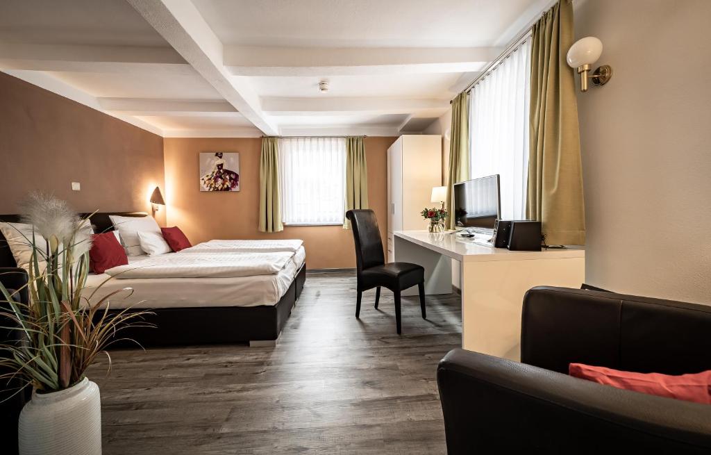 Postel nebo postele na pokoji v ubytování Le petit Palais - Hotel/Pension
