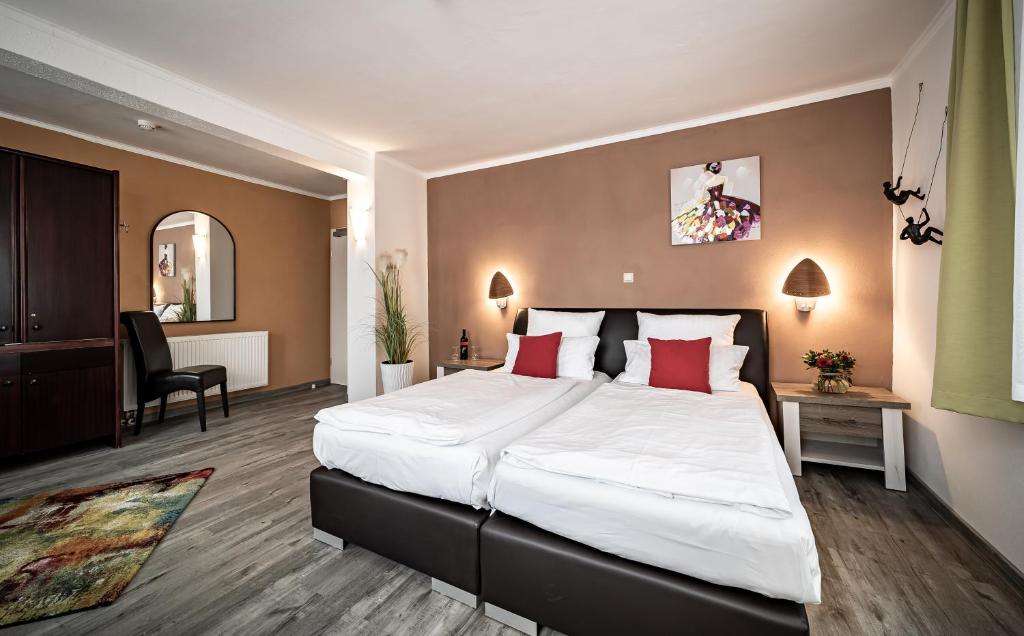 Postel nebo postele na pokoji v ubytování Le petit Palais - Hotel/Pension
