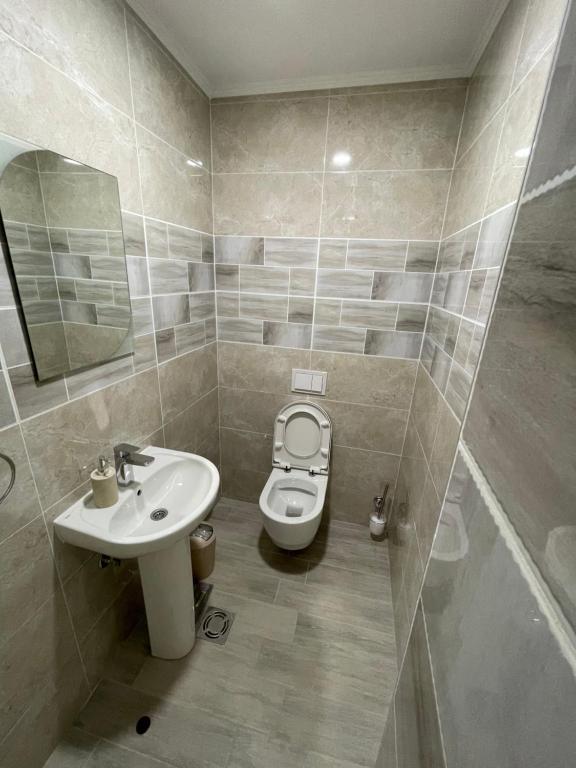 Koupelna v ubytování M Apartments