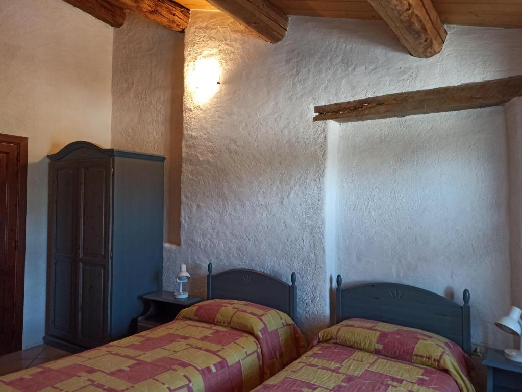 A bed or beds in a room at Agriturismo Alla Vecchia Quercia