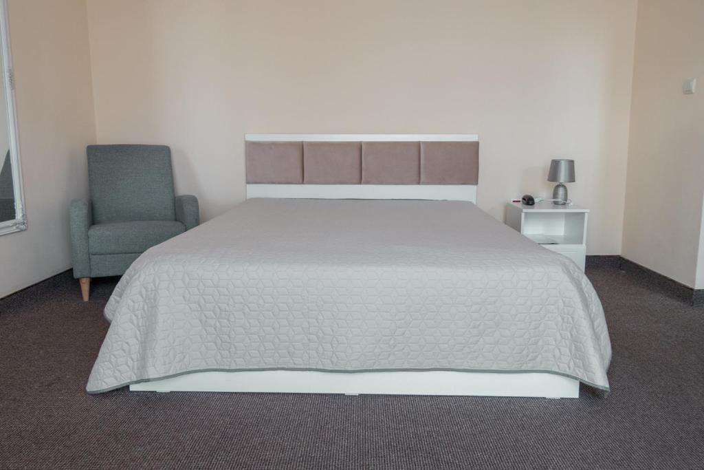 Postel nebo postele na pokoji v ubytování Hotel Class