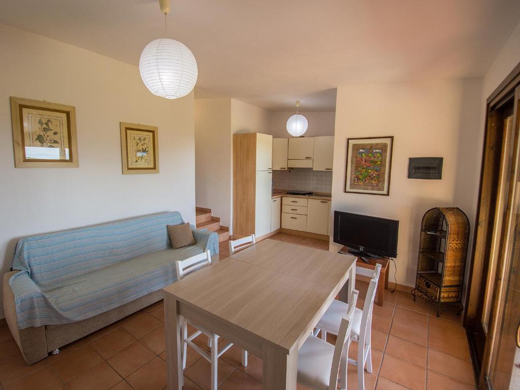 TV a/nebo společenská místnost v ubytování Residence Cala Petralana
