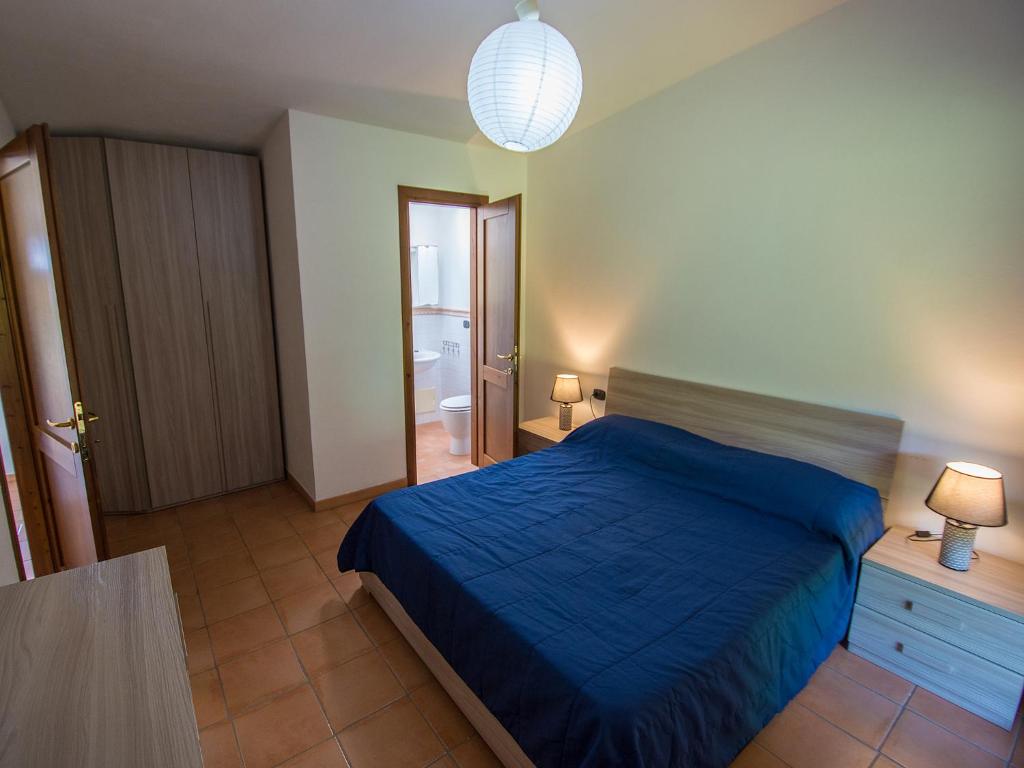 Postel nebo postele na pokoji v ubytování Residence Cala Petralana