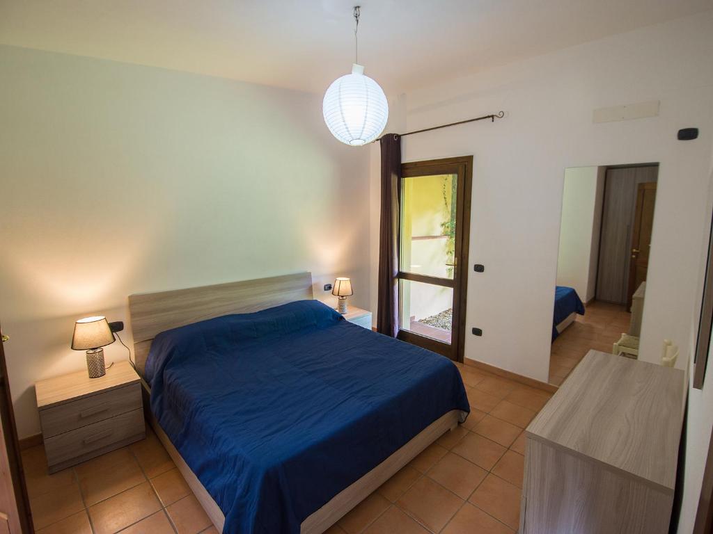 Postel nebo postele na pokoji v ubytování Residence Cala Petralana