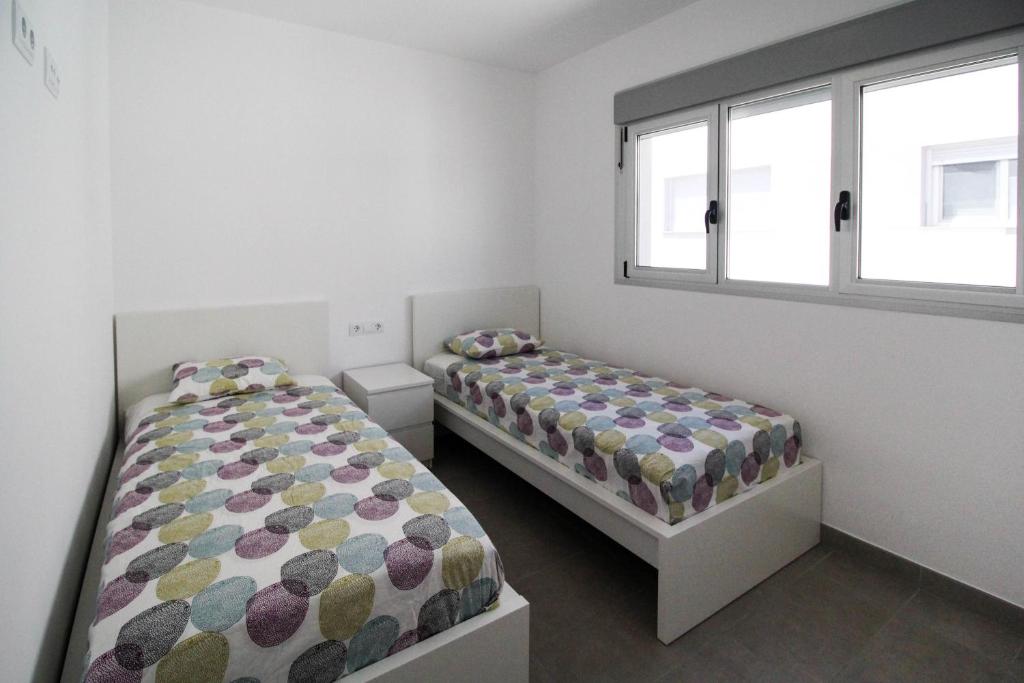 A bed or beds in a room at Townhouse Casa Champis