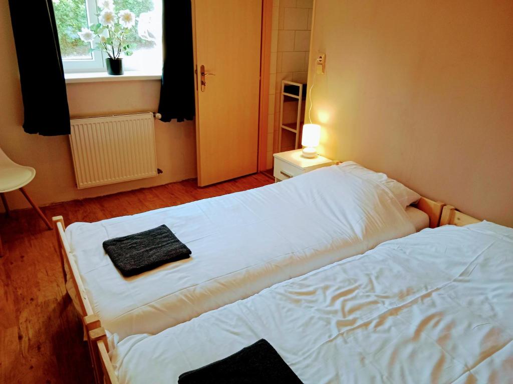 Postel nebo postele na pokoji v ubytování Pension Liberta