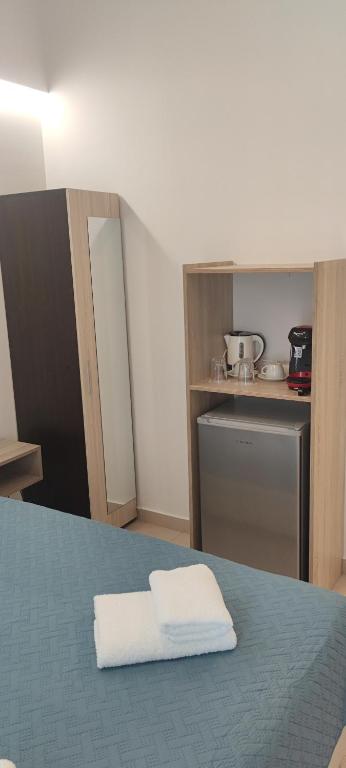 Postel nebo postele na pokoji v ubytování Afroditi Hotel