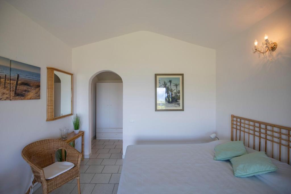 A bed or beds in a room at Villetta Azzurra, un incanto vista mare