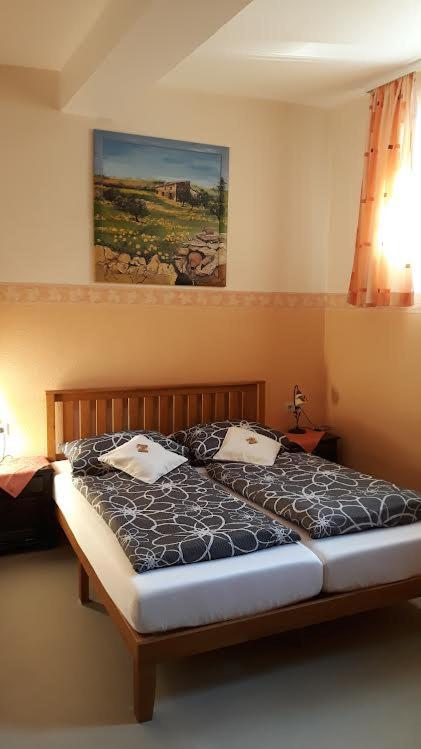 Postel nebo postele na pokoji v ubytování Gästehaus Grüner Baum
