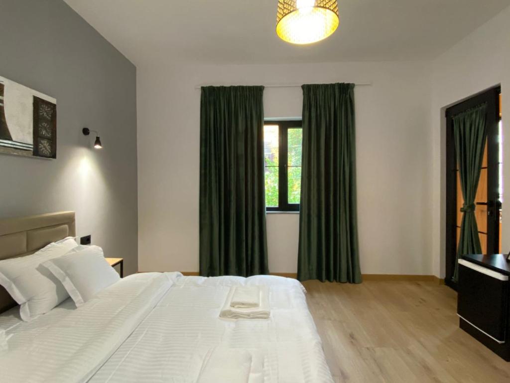 Postel nebo postele na pokoji v ubytování Vila Jasmine