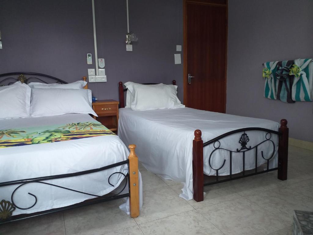 Postel nebo postele na pokoji v ubytování Tyvabro Guesthouse