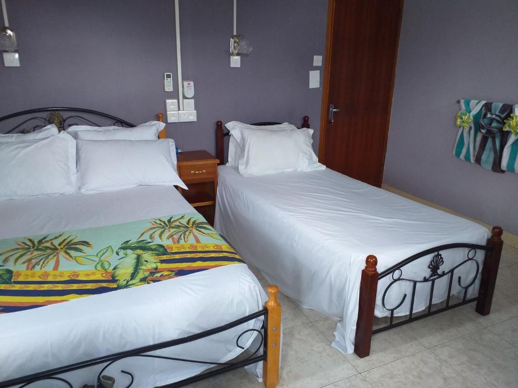 Postel nebo postele na pokoji v ubytování Tyvabro Guesthouse