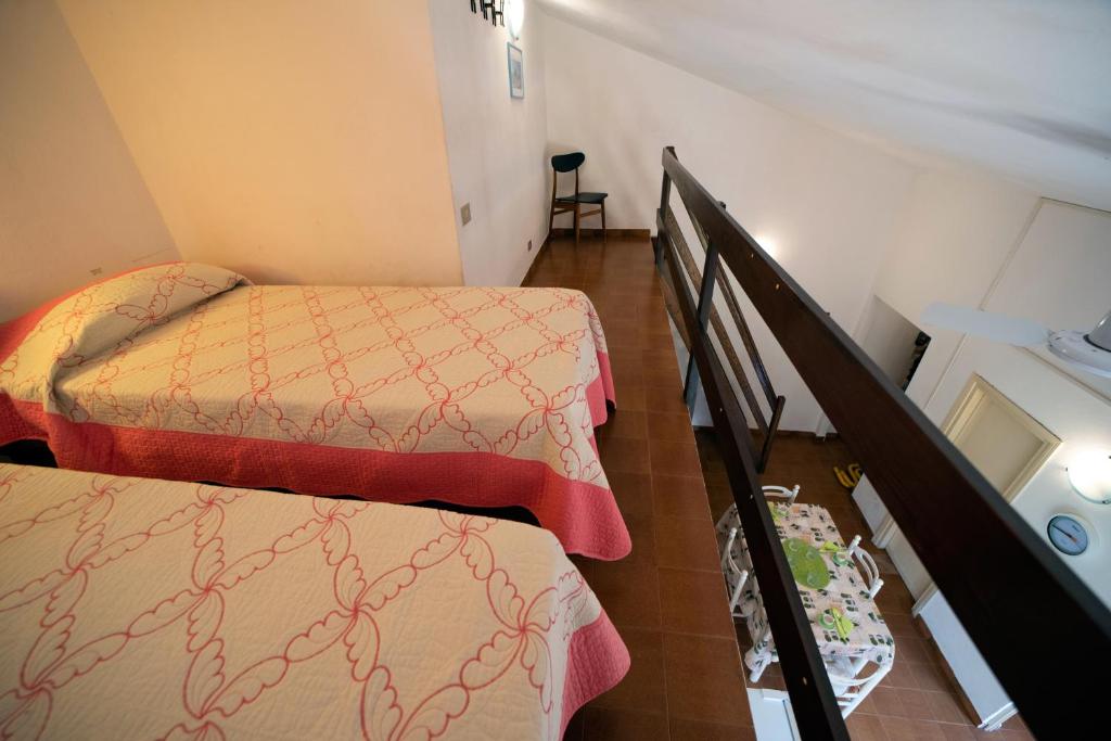 A bed or beds in a room at Appartamento Laura