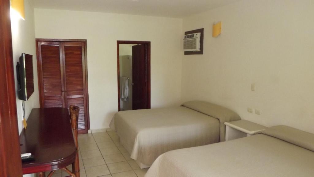 Postel nebo postele na pokoji v ubytování Hotel Istirinchá
