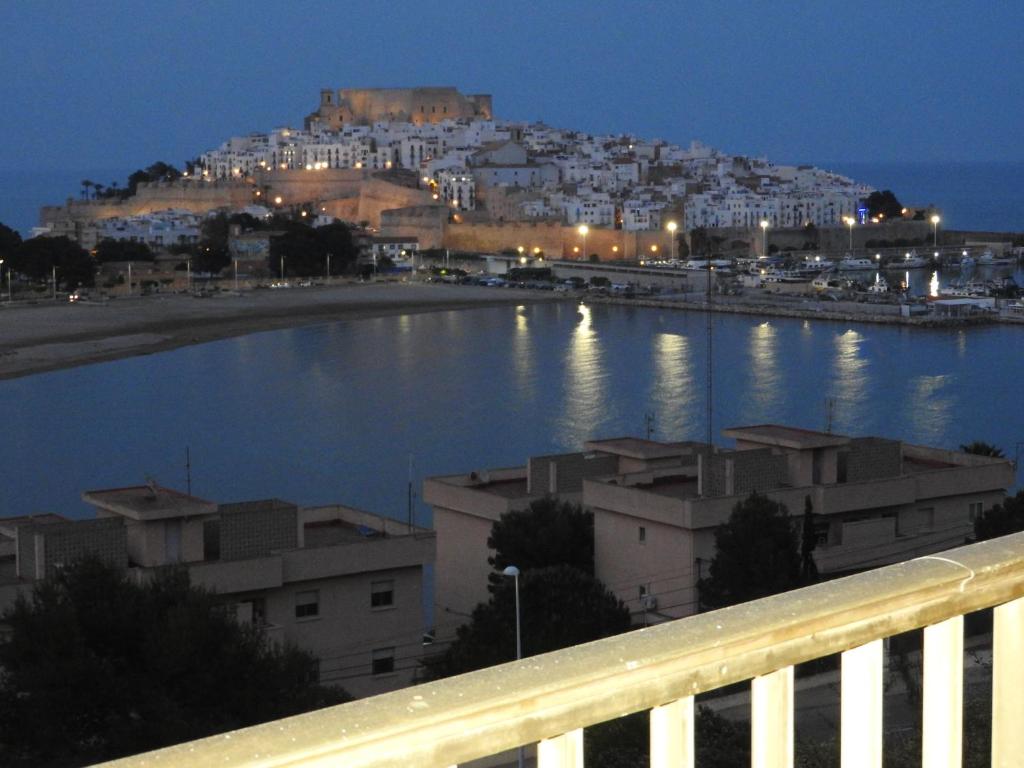 a view of a body of water at night at THE VIEWS, LAS VISTAS in Peñíscola