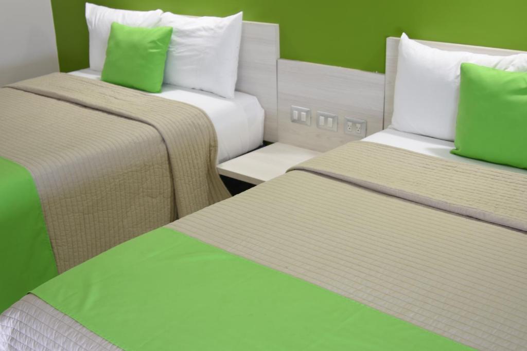Postel nebo postele na pokoji v ubytování SC HOTEL