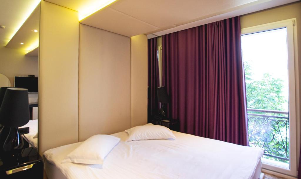 Letto o letti in una camera di Senator Hotel