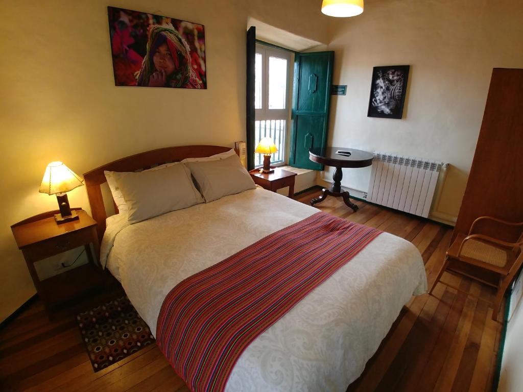 Postel nebo postele na pokoji v ubytování Hostal Corihuasi