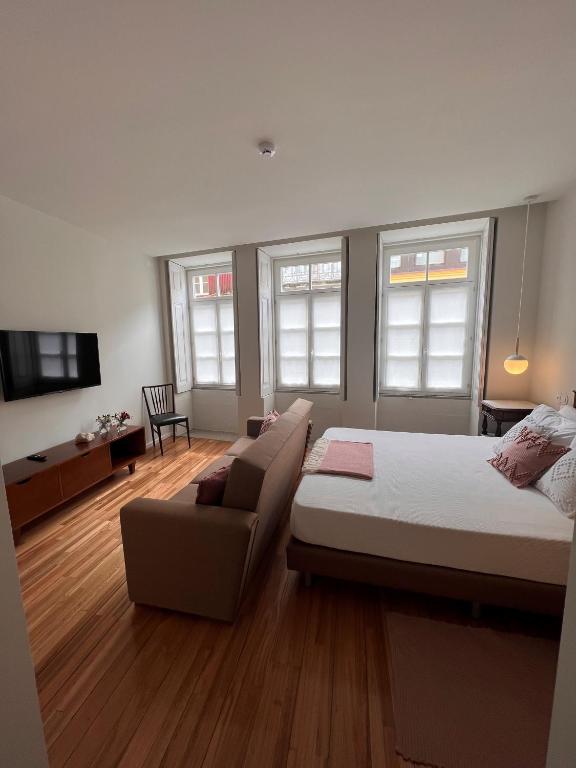 Een bed of bedden in een kamer bij Pensao O Laranjeira