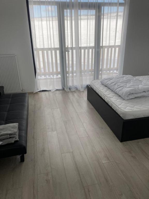 Pensiunea CASA SPANDO - Double Room Deluxe (2 Adultos + 1 Criança)