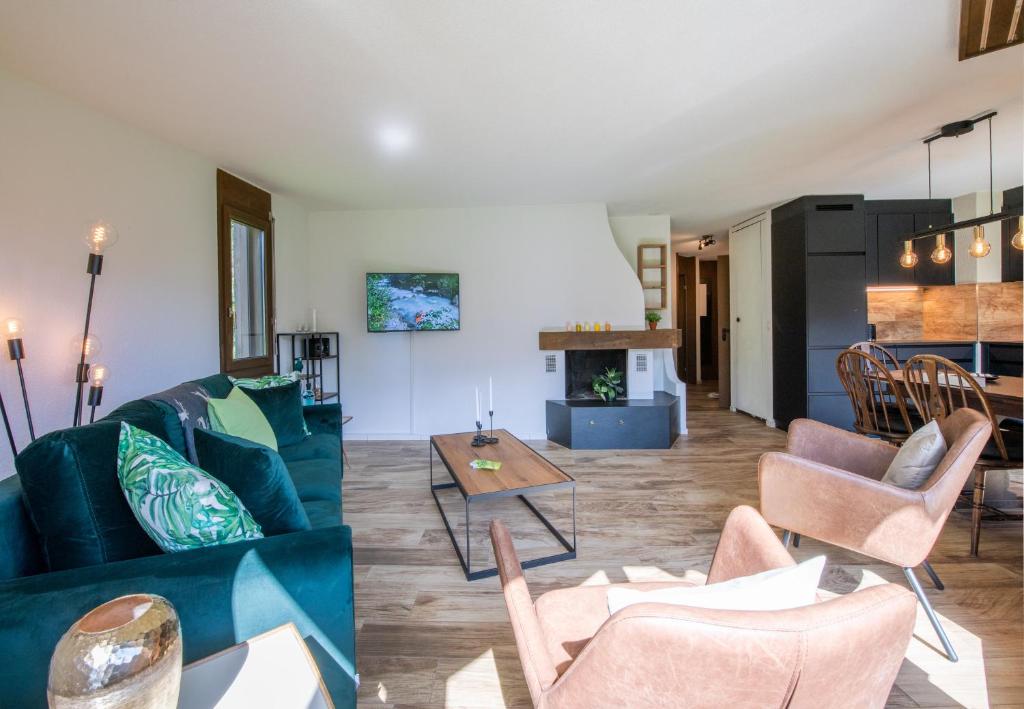 TV a/nebo společenská místnost v ubytování Chalet Petunia