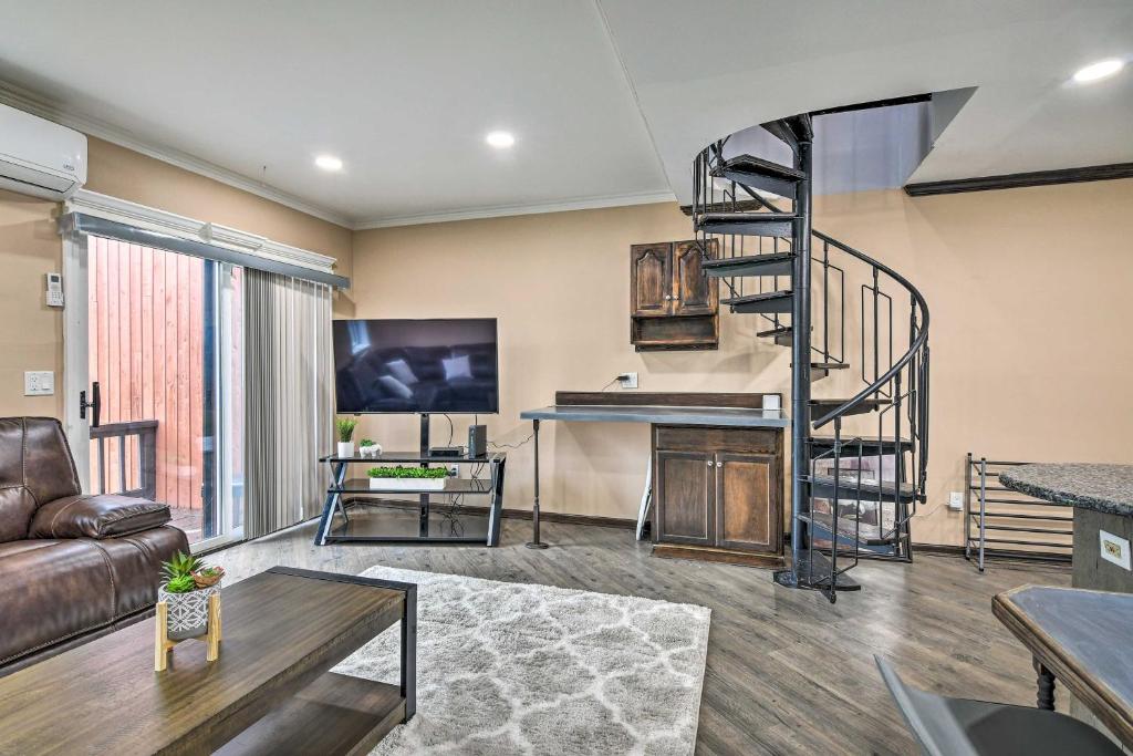 a living room with a spiral staircase and a piano at Great Gorge Getaway with Community Amenities! in Vernon Township