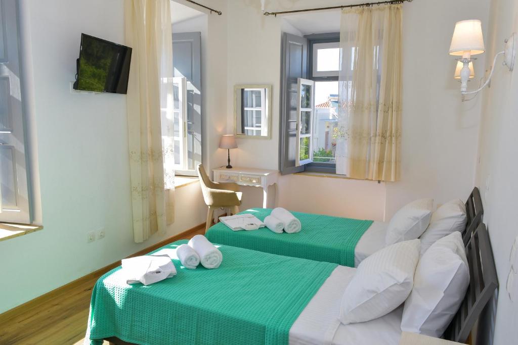 Postel nebo postele na pokoji v ubytování Mansion Dasi