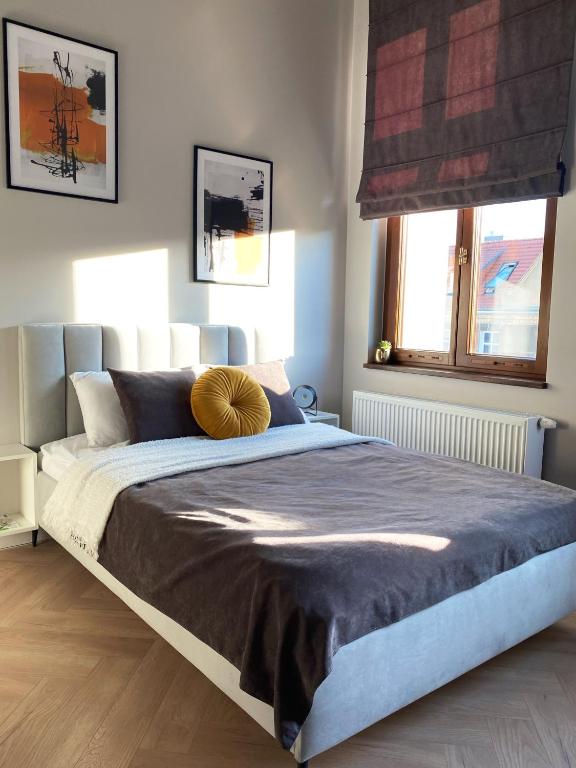 Posteľ alebo postele v izbe v ubytovaní Apartament_poznań CH10