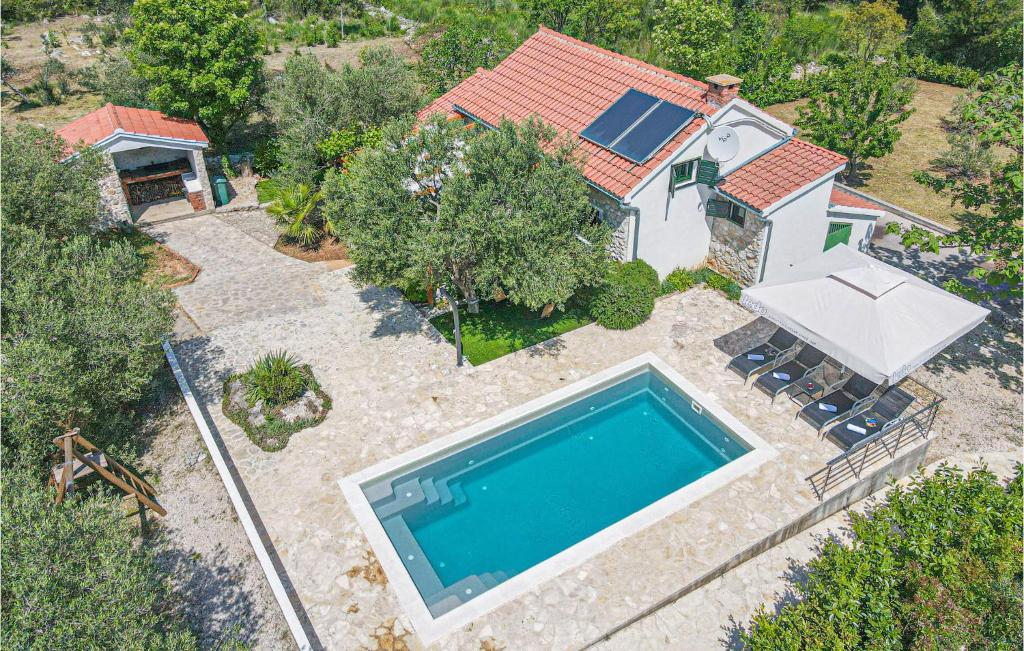 an aerial view of a house with a swimming pool at Stunning Home In Vodice With 2 Bedrooms, Wifi And Outdoor Swimming Pool in Vodice
