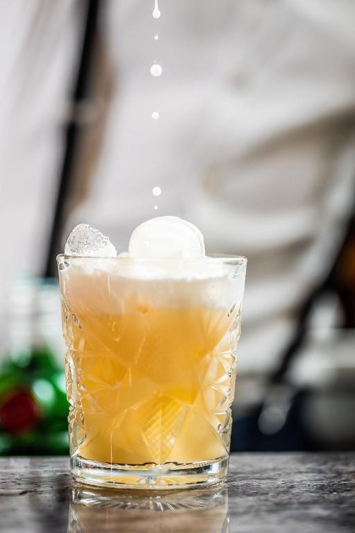 a glass of iced tea on a table at Hotel Albatros Varigotti in Varigotti