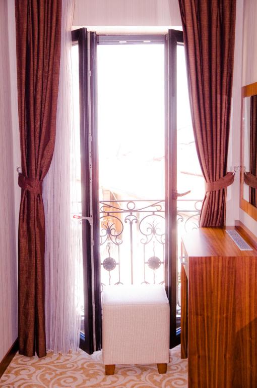 Postel nebo postele na pokoji v ubytování Kerimbey Hotel