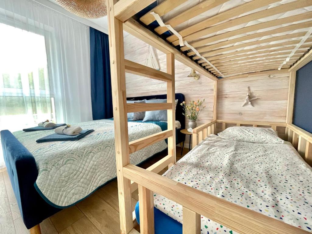 Posteľ alebo postele v izbe v ubytovaní Harbour View Gdynia