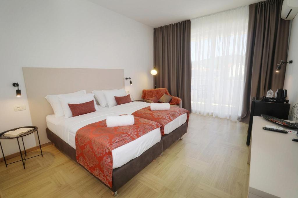 Postel nebo postele na pokoji v ubytování Luxury Villa Magico