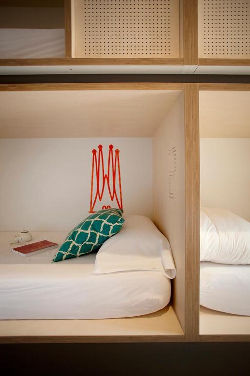 a shelf with two beds in a room at TOC Hostel Barcelona in Barcelona