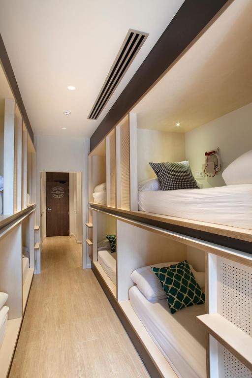 a room with two bunk beds and a hallway at TOC Hostel Barcelona in Barcelona