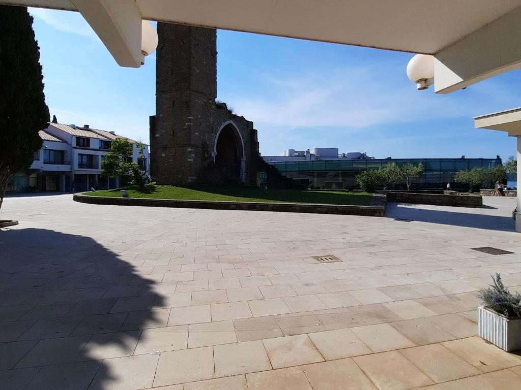 a courtyard with a monument in the distance at Apartment Kristjan in Portorož