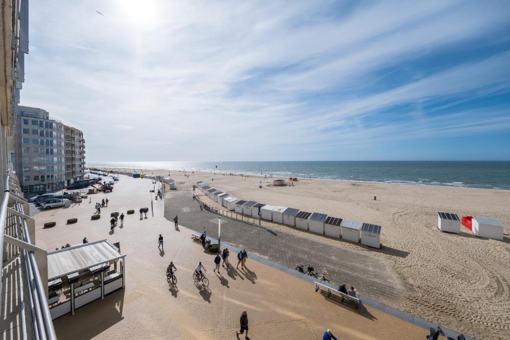 a view of a beach with people and the ocean at Apartment 2 bedrooms with magnificent seaview and free parking in Ostend
