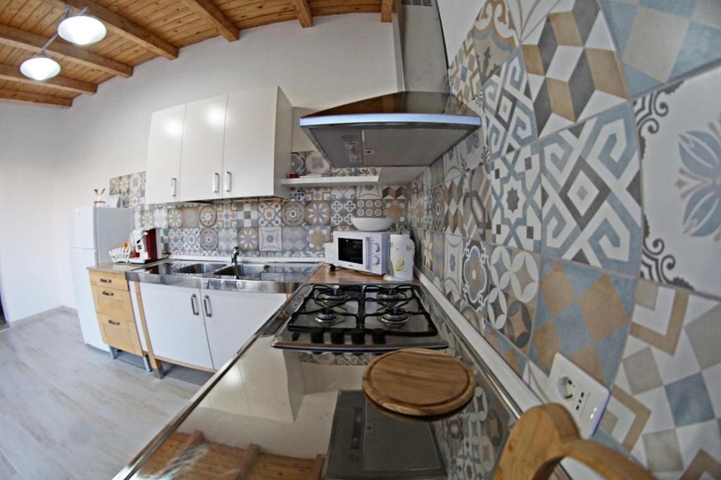 Kuchyň nebo kuchyňský kout v ubytování Holiday House Villa AleGiù Marzamemi