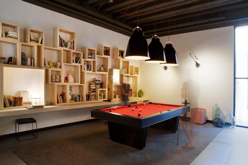 a room with a red pool table in it at TOC Hostel Barcelona in Barcelona