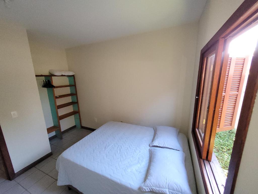 Ένα ή περισσότερα κρεβάτια σε δωμάτιο στο Partiu Praia SC- Pinheira