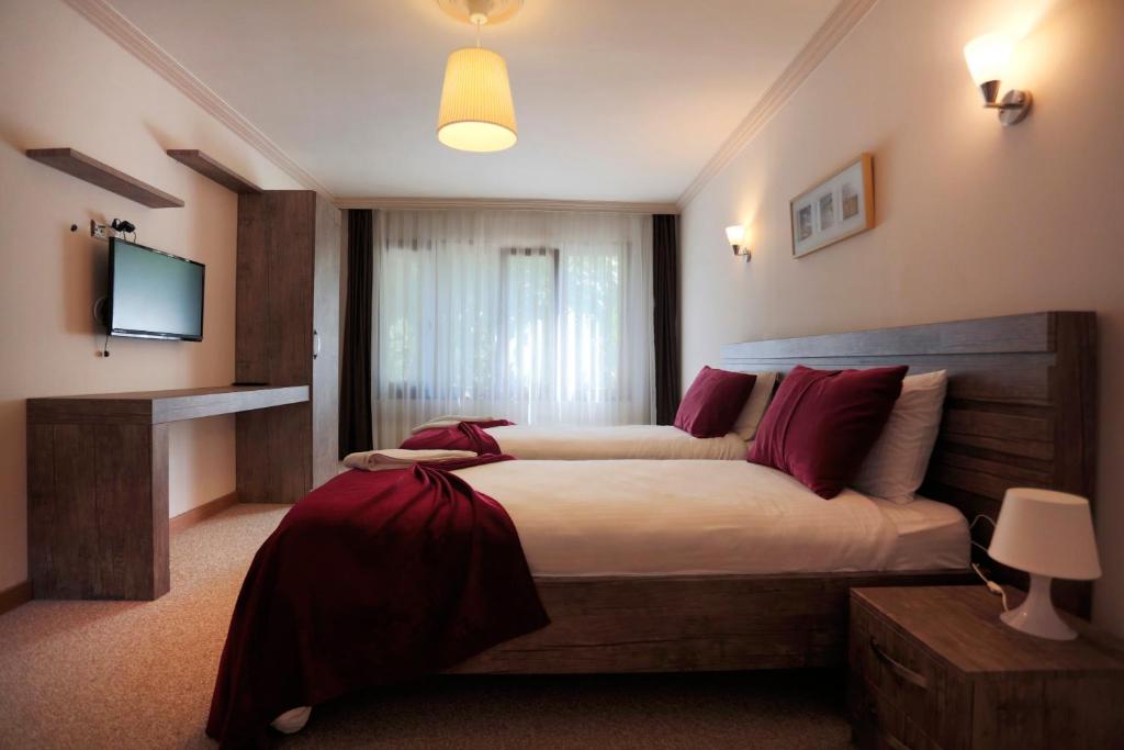 Postel nebo postele na pokoji v ubytování Kapri Termal Hotel & Kaplica Yalova