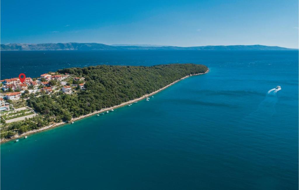 an island in the middle of a large body of water at Amazing Apartment In Labin With Kitchen in (( Hrvatini ))