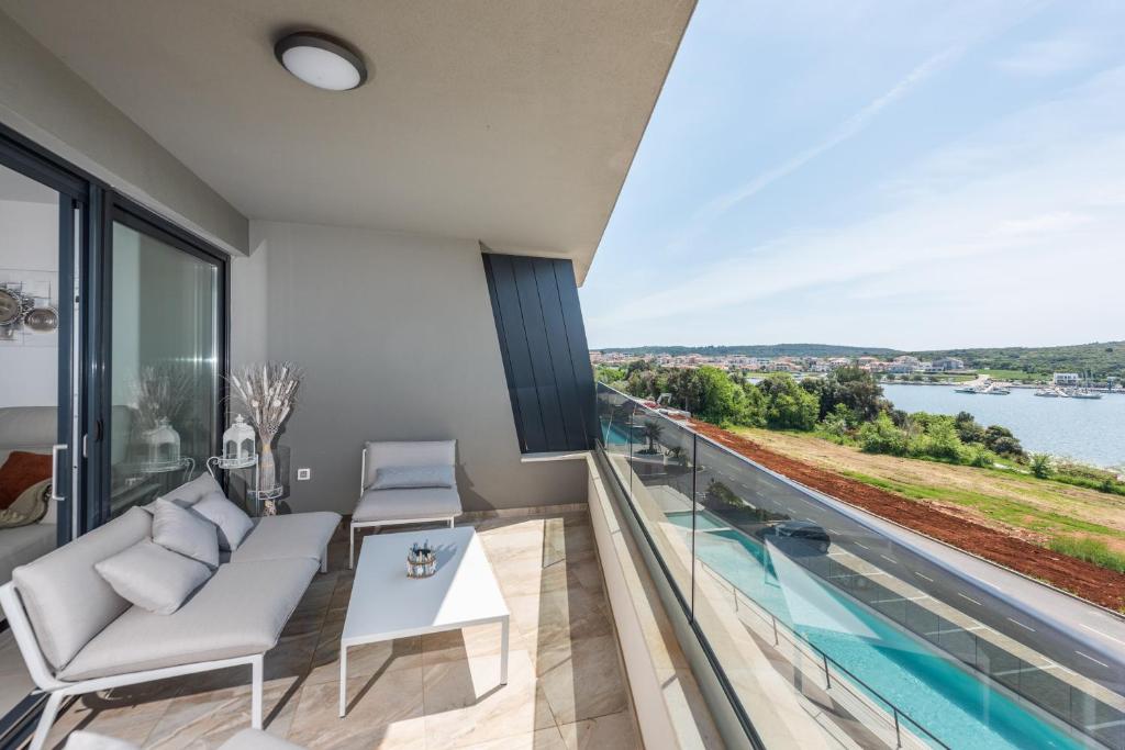 a living room with a view of the water at Apartment MaLu in Banjole
