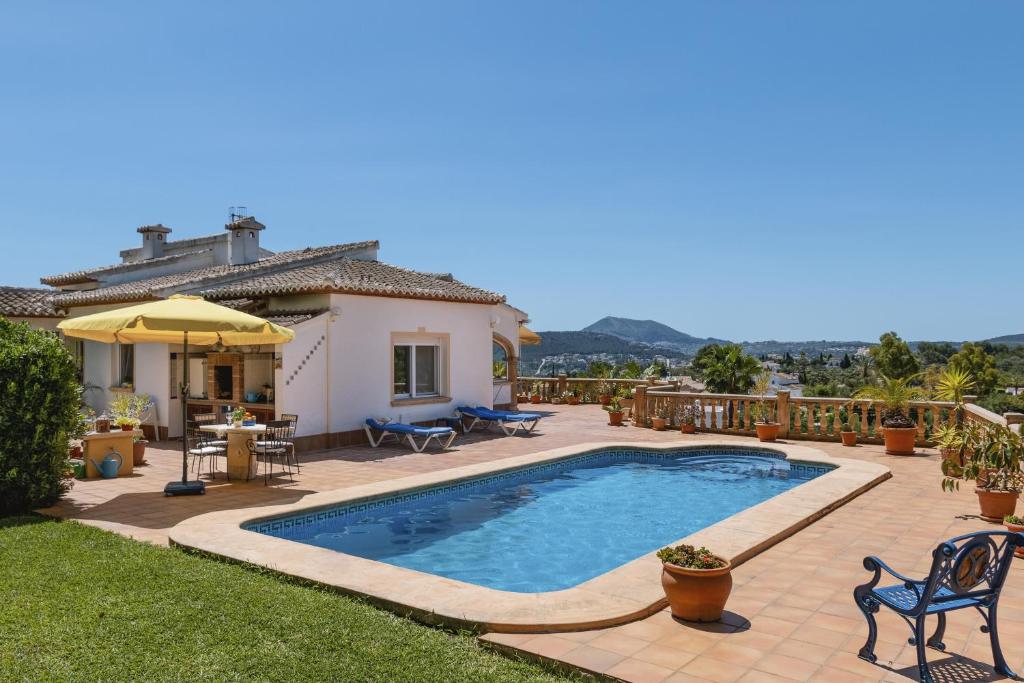 a swimming pool in the backyard of a house at Casa Margot 6 in Jávea